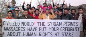 Demonstrators protest against Syria's President Assad after Friday prayers in Kafranbel
