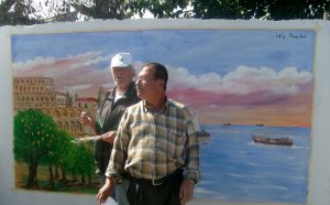 Two mural artists in Ein El Hillweh camp