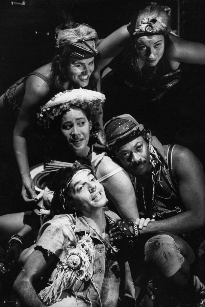 The perfomers in HUSH, huddled together, with a range of fearful, wicked and ingratiating expressions on their faces. Tabby Johnson is in the centre, with James Tait and Jimmie Earl Perry beside her and Randi Helmers and Holly Cole behind her.