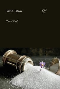 The cover of Salt & Snow, featuring a photo of a bronze salt cellar, tipped on its side and overflowing with salt out of which emerges a small violet flower. Photo by John Luke Chapman.
