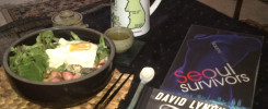 The US edition of Seoul Survivors, with a bowl of Korean food.