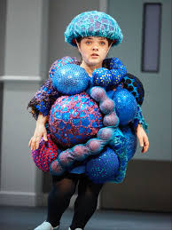 Actor dressed as cancer cells